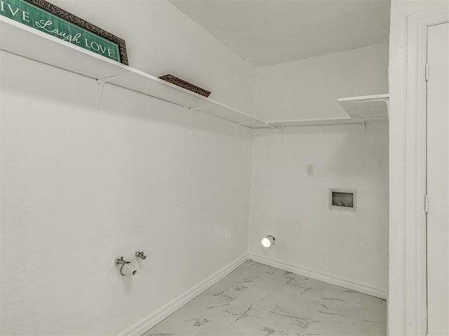 laundry room with marble finish floor, laundry area, hookup for a washing machine, and baseboards