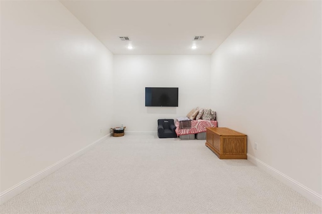 interior space with carpet floors, visible vents, and baseboards