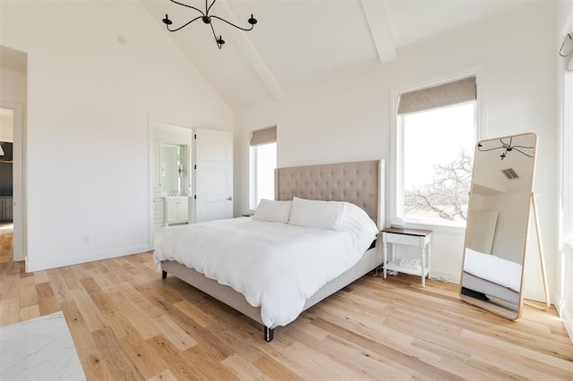 bedroom with beam ceiling, ensuite bath, high vaulted ceiling, light wood-type flooring, and baseboards