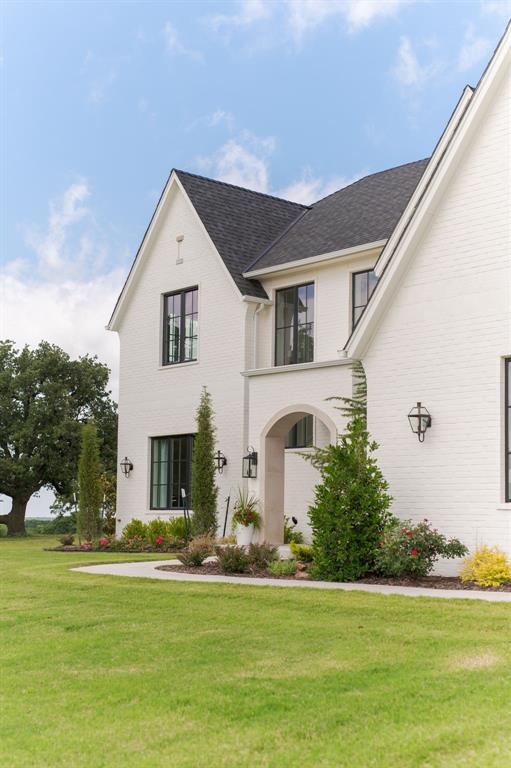 2909 High View Dr, Arcadia, OK 73007 - view of front facade featuring a front lawn, brick siding, and a shingled roof