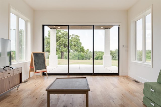 2909 High View Dr, Arcadia, OK 73007 - living area featuring plenty of natural light and light wood-style flooring