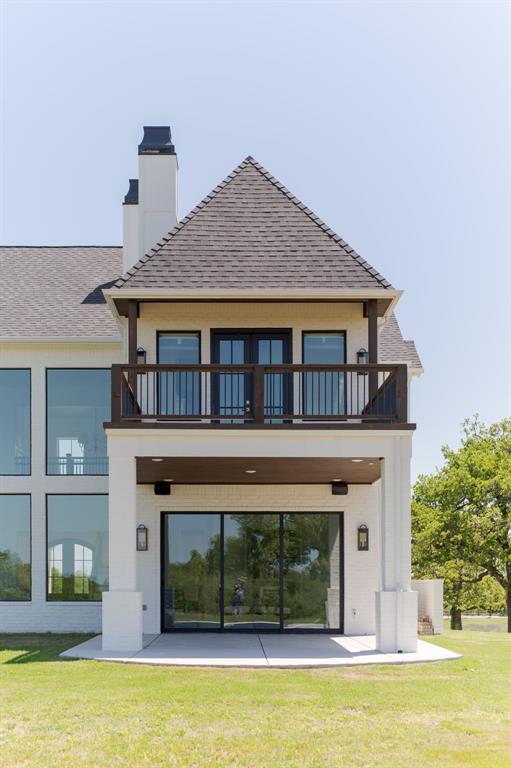 2909 High View Dr, Arcadia, OK 73007 - back of property featuring a balcony, a chimney, and roof with shingles