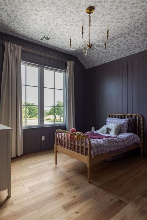 2909 High View Dr, Arcadia, OK 73007 - bedroom with a chandelier and light wood-type flooring
