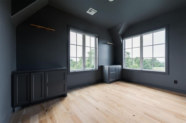2909 High View Dr, Arcadia, OK 73007 - spare room with healthy amount of natural light, light wood-style flooring, and lofted ceiling