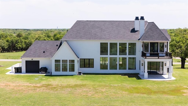 2909 High View Dr, Arcadia, OK 73007 - back of property featuring a chimney, a patio, a garage, a yard, and stucco siding