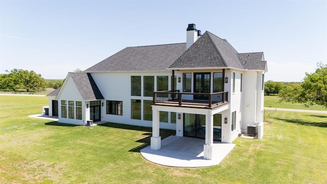 2909 High View Dr, Arcadia, OK 73007 - rear view of property featuring a patio area, a balcony, a chimney, a lawn, and stucco siding