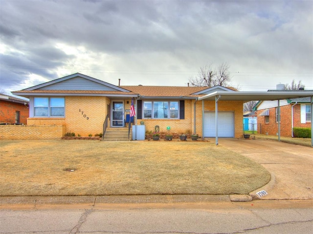 single story home with a garage, a carport, brick siding, and concrete driveway