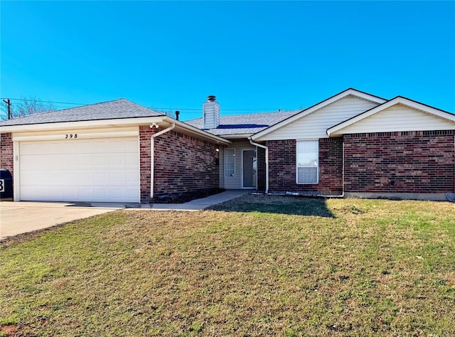 ranch-style house featuring brick siding, a chimney, an attached garage, driveway, and a front lawn