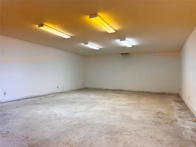 empty room with concrete flooring