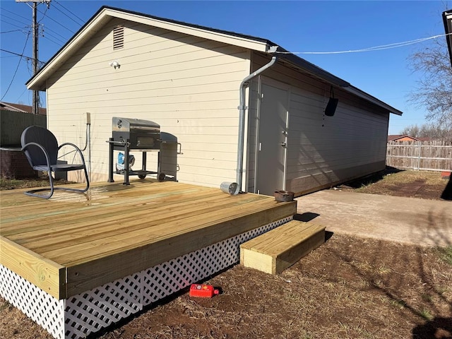 exterior space with a deck and fence