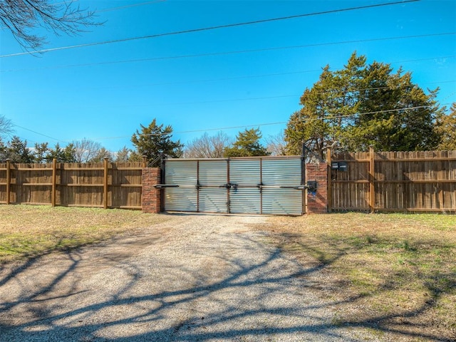 exterior space with a gate and fence