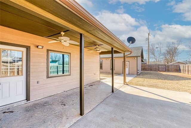 view of patio / terrace featuring ceiling fan and fence