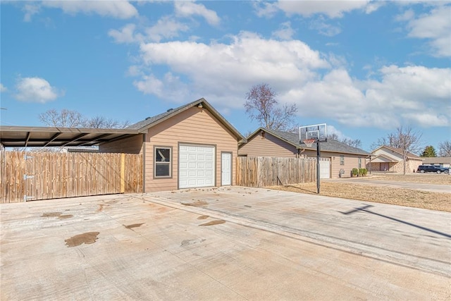 exterior space with fence and driveway