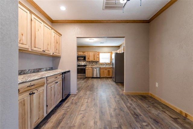 kitchen featuring appliances with stainless steel finishes, dark wood-type flooring, crown molding, and light brown cabinetry