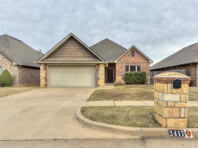 view of front of property with a garage, stone siding, concrete driveway, and roof with shingles