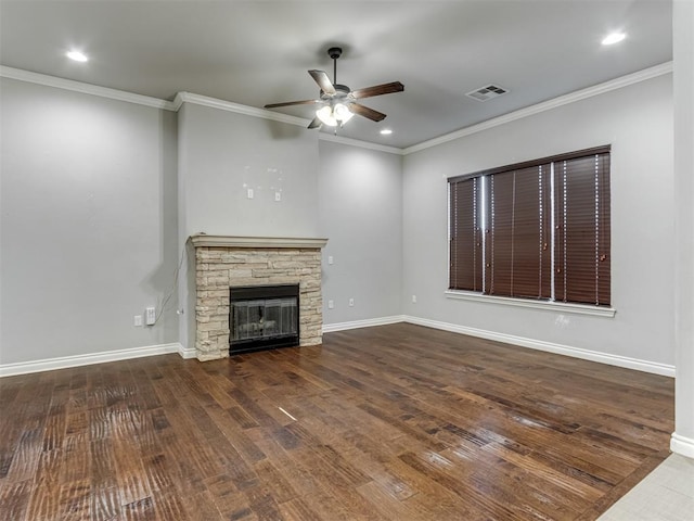 unfurnished living room with baseboards, a fireplace, visible vents, and wood finished floors