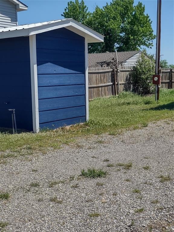 garage with fence