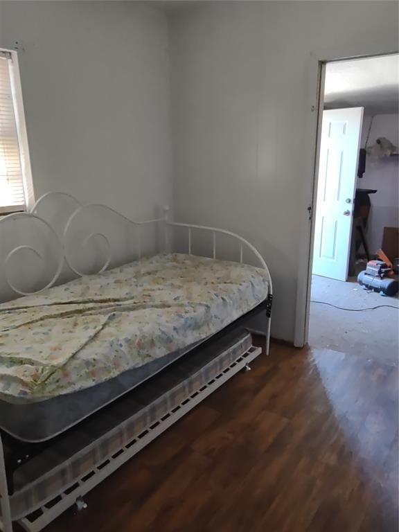 bedroom featuring wood finished floors