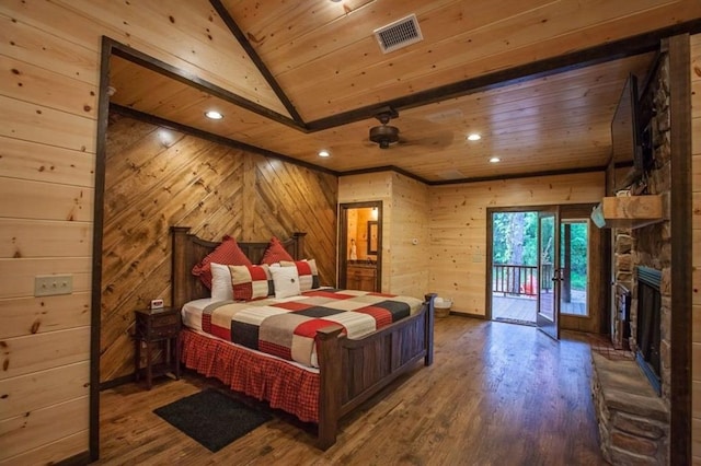 bedroom featuring wooden ceiling, a fireplace, wood finished floors, visible vents, and access to exterior