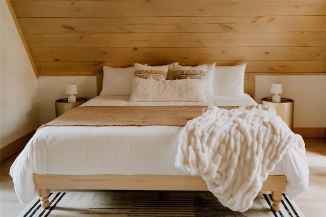 bedroom with wood ceiling and vaulted ceiling