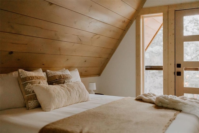 bedroom featuring vaulted ceiling