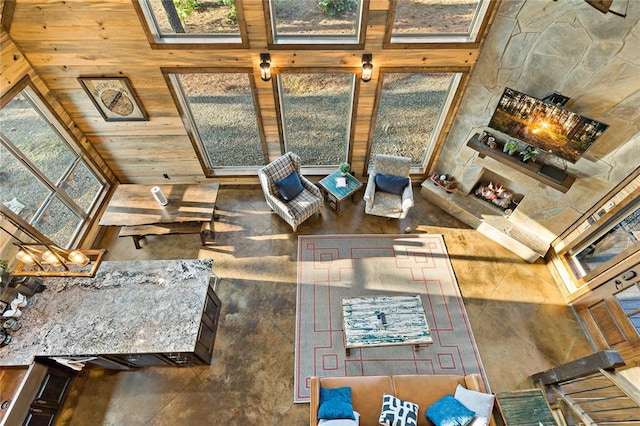 unfurnished living room featuring a towering ceiling