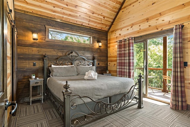 bedroom featuring wooden walls, lofted ceiling, wood ceiling, access to exterior, and carpet flooring