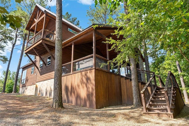 view of property exterior featuring faux log siding