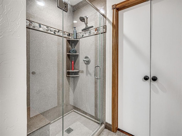 bathroom featuring a shower stall