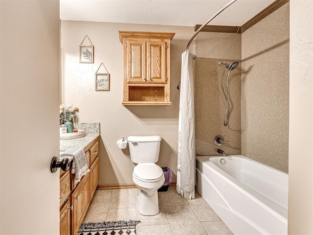 full bath featuring toilet, vanity, baseboards, tile patterned floors, and shower / bath combo