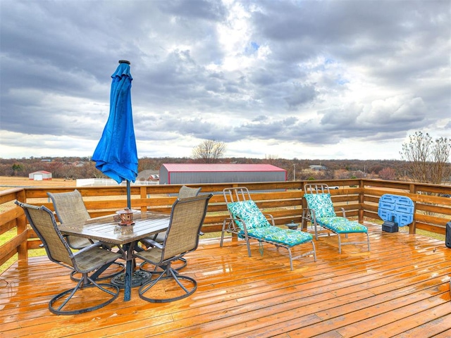 deck featuring outdoor dining area