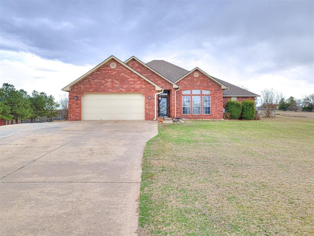 ranch-style house featuring a garage, brick siding, concrete driveway, roof with shingles, and a front yard