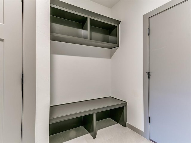 mudroom featuring baseboards and tile patterned floors