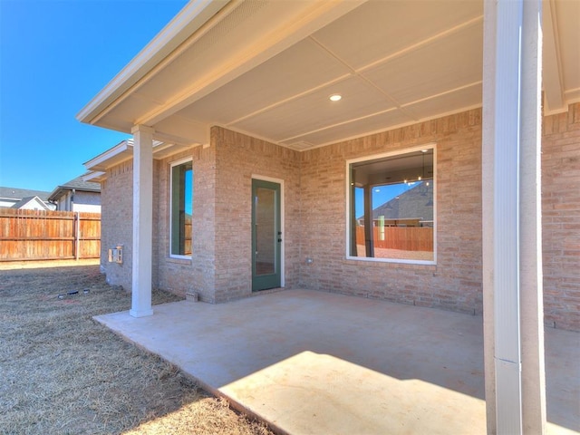 view of patio / terrace featuring fence