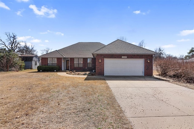 ranch-style house with brick siding, driveway, an attached garage, and roof with shingles