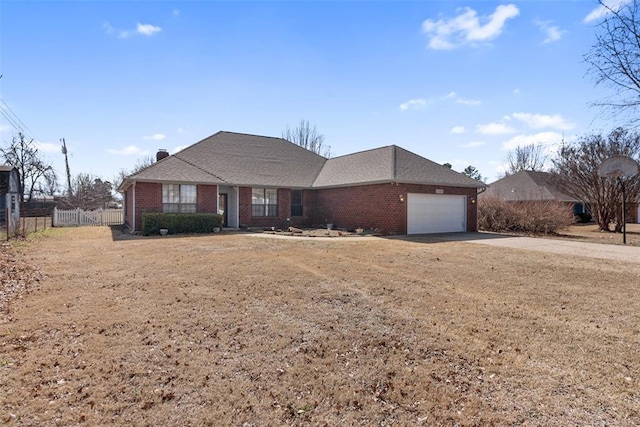 ranch-style house with an attached garage, brick siding, fence, driveway, and a chimney