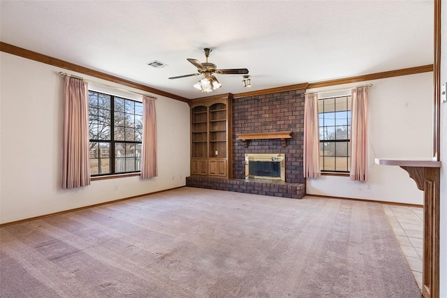 unfurnished living room with visible vents, baseboards, ceiling fan, ornamental molding, and a brick fireplace