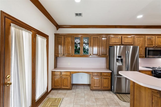 kitchen featuring visible vents, built in study area, stainless steel appliances, crown molding, and light countertops