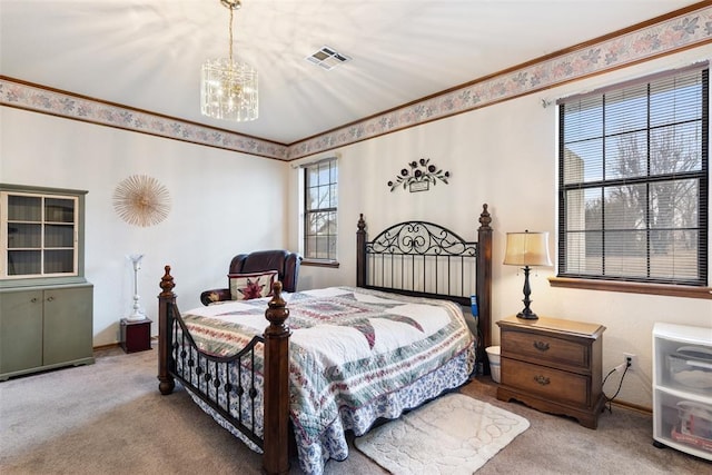 bedroom with an inviting chandelier, carpet, visible vents, and crown molding