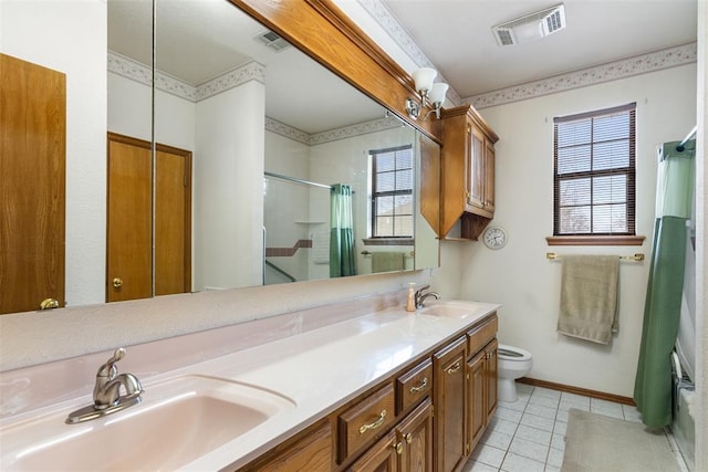 bathroom with visible vents, a sink, and toilet