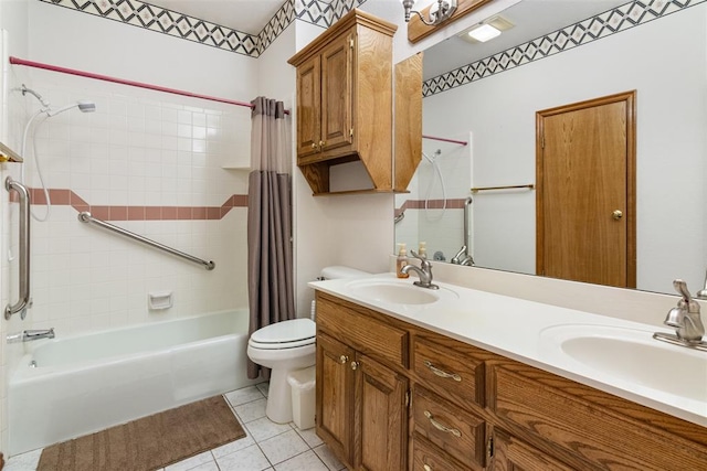 bathroom with shower / bath combination with curtain, tile patterned flooring, a sink, and toilet