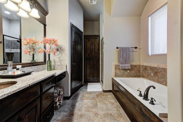 full bath with visible vents, vanity, a shower stall, tile patterned floors, and a tub with jets