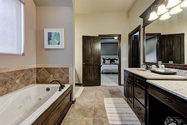 bathroom with a whirlpool tub, ensuite bath, vanity, and a notable chandelier