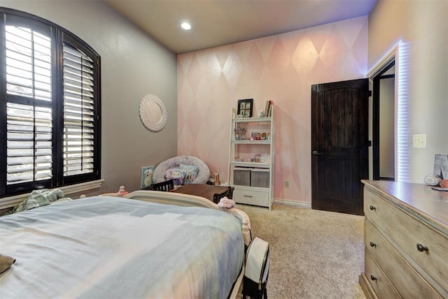 carpeted bedroom with multiple windows, recessed lighting, and baseboards