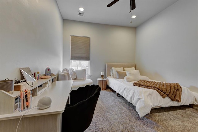 carpeted bedroom with visible vents, a ceiling fan, and recessed lighting