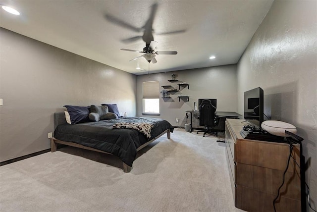 bedroom with recessed lighting, a textured wall, a ceiling fan, light carpet, and baseboards