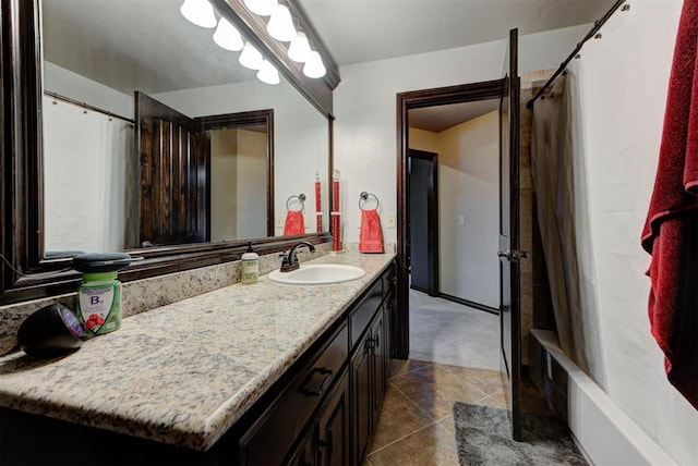 full bath featuring shower / bathtub combination with curtain, vanity, and tile patterned floors