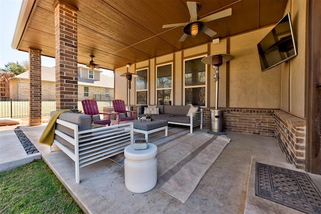 view of patio featuring an outdoor living space and a ceiling fan