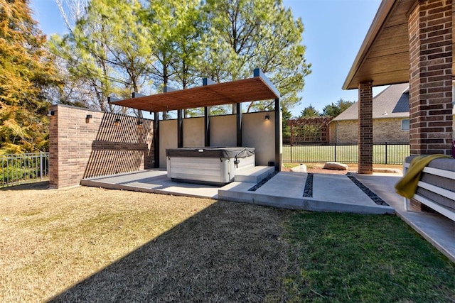 exterior space with a hot tub and fence