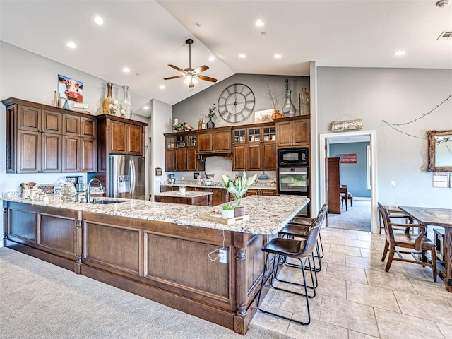 344750 E 830th Rd, Chandler, OK 74834 - kitchen with stainless steel appliances, a ceiling fan, lofted ceiling, a peninsula, and a sink